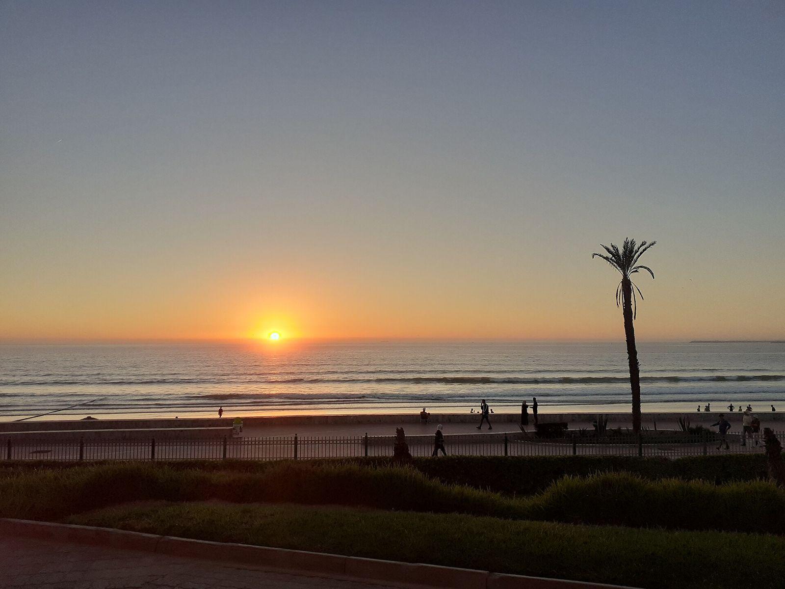 Wide sandy beach of Agadir with the seafront and hills in the background