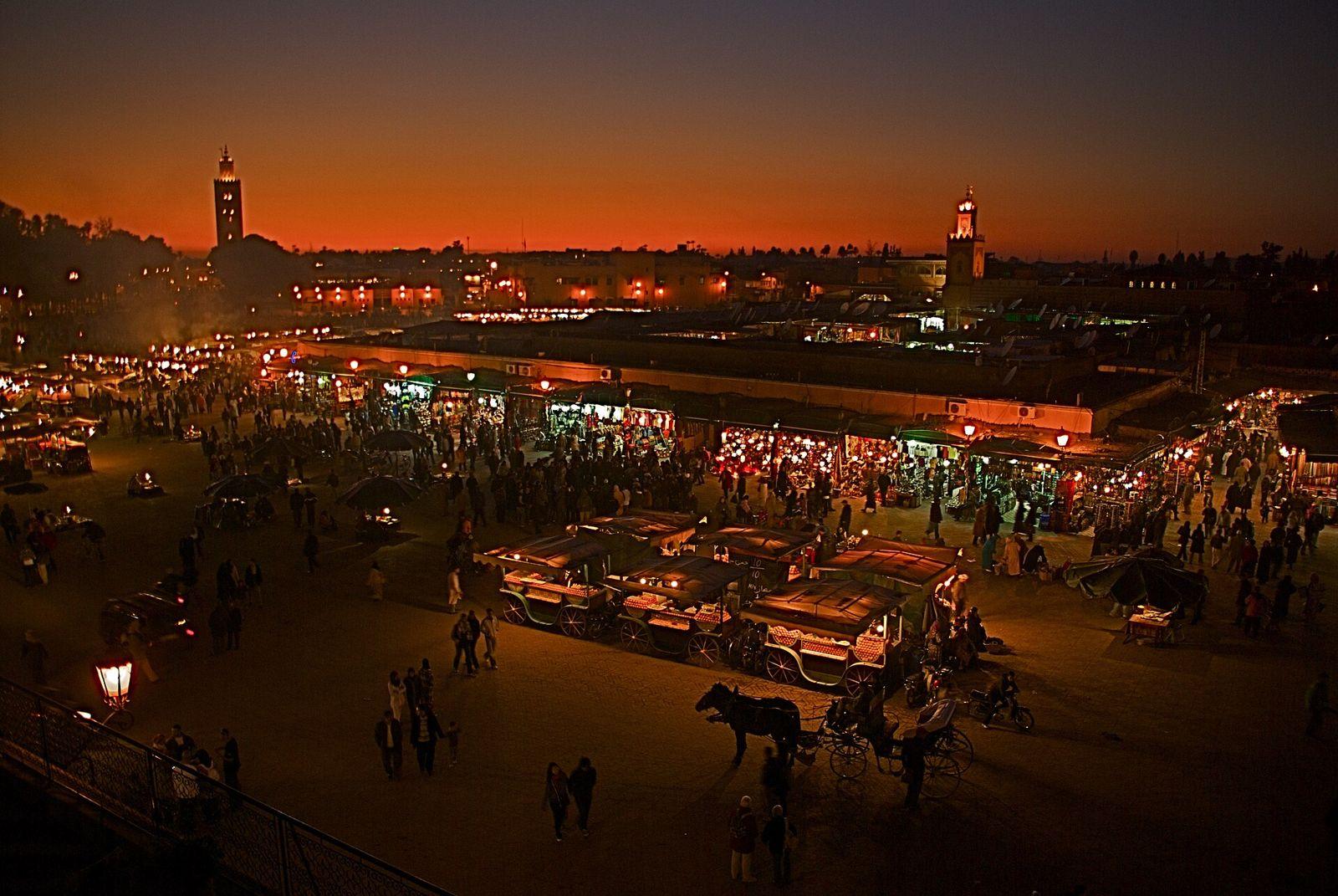 Jemaa el-Fna square at dusk with the Koutoubia minaret