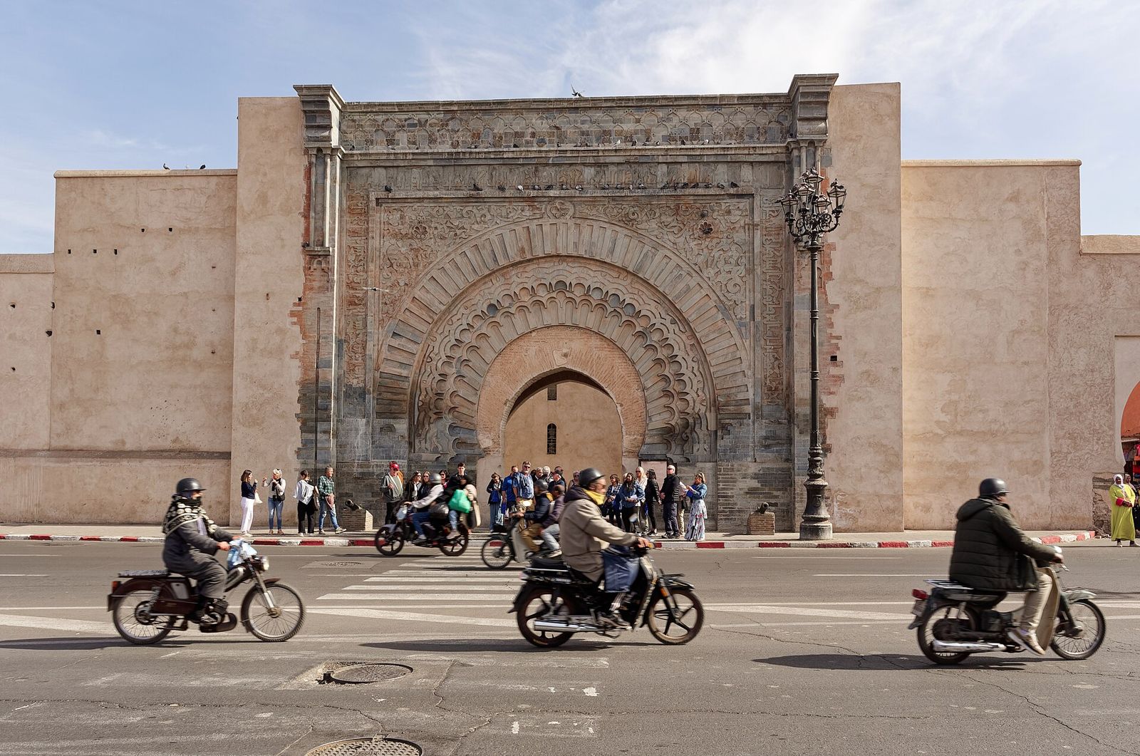 Motorbikes passing Bab Agnaou, the kasbah gate